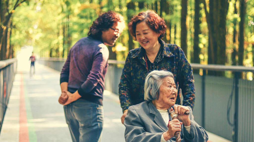 caregivers and woman in wheelchair